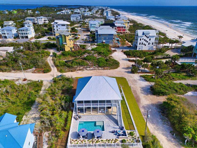 Aerial view of the house, the dunes and the beach along the coast