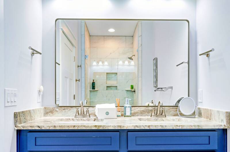 Bathroom with a double vanity and a walk-in shower